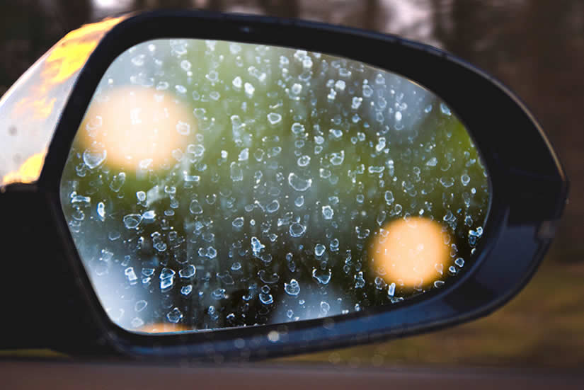Watermarks and stains on a car mirror can be difficult to clean